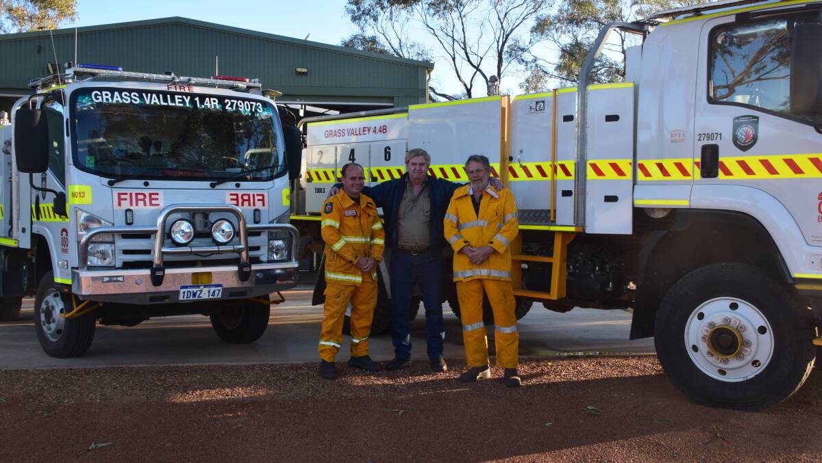 Extra support: Grass Valley Volunteer Bush Fire Service members Chris Marris, Gary Shepherdson and captain Angus Cooke with the crew's two appliances. Photo: Eliza Wynn.
