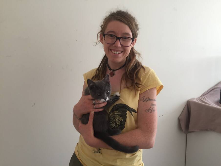 Helping hand: Saving Animals From Euthanasia (SAFE) Avon Valley staff member Freedom Bradbury with one of the 100 cats up for adoption. Photo: Eliza Wynn. 