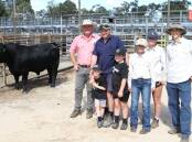With the $12,500 top-priced bull Gandy Three Rivers U83 (AI) (by USA Ellingson Three Rivers 8062) at the Gandy Angus yearling bull sale at Boyanup last week were Elders Manjimup/Pemberton representative Brad McDonnell (left), buyer Shane Blakers, CT Blakers, Manjimup, and his sons Cole and Louis and Lola, Roamy and Steven Gandy, Gandy Angus stud.
