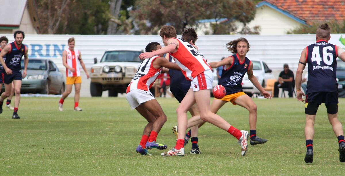 In with a shot: Federals Reserves in a prelim match last September. Photo: supplied.
