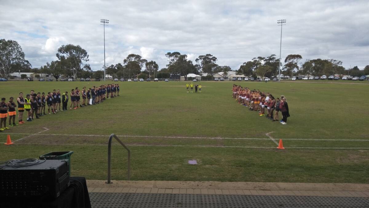 Ready to play: Federals lined up for Welcome to Country ahead of the derby game on August 18. Photos: Supplied.