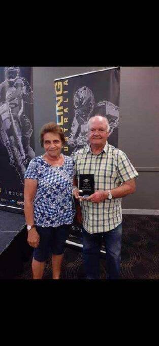 Proud moment: Bronka and Bob Hughes gratefully accept the NDMCC's trophy for Most Improved Club of 2019 at a recent Motorcycling WA event. Photo: Supplied.